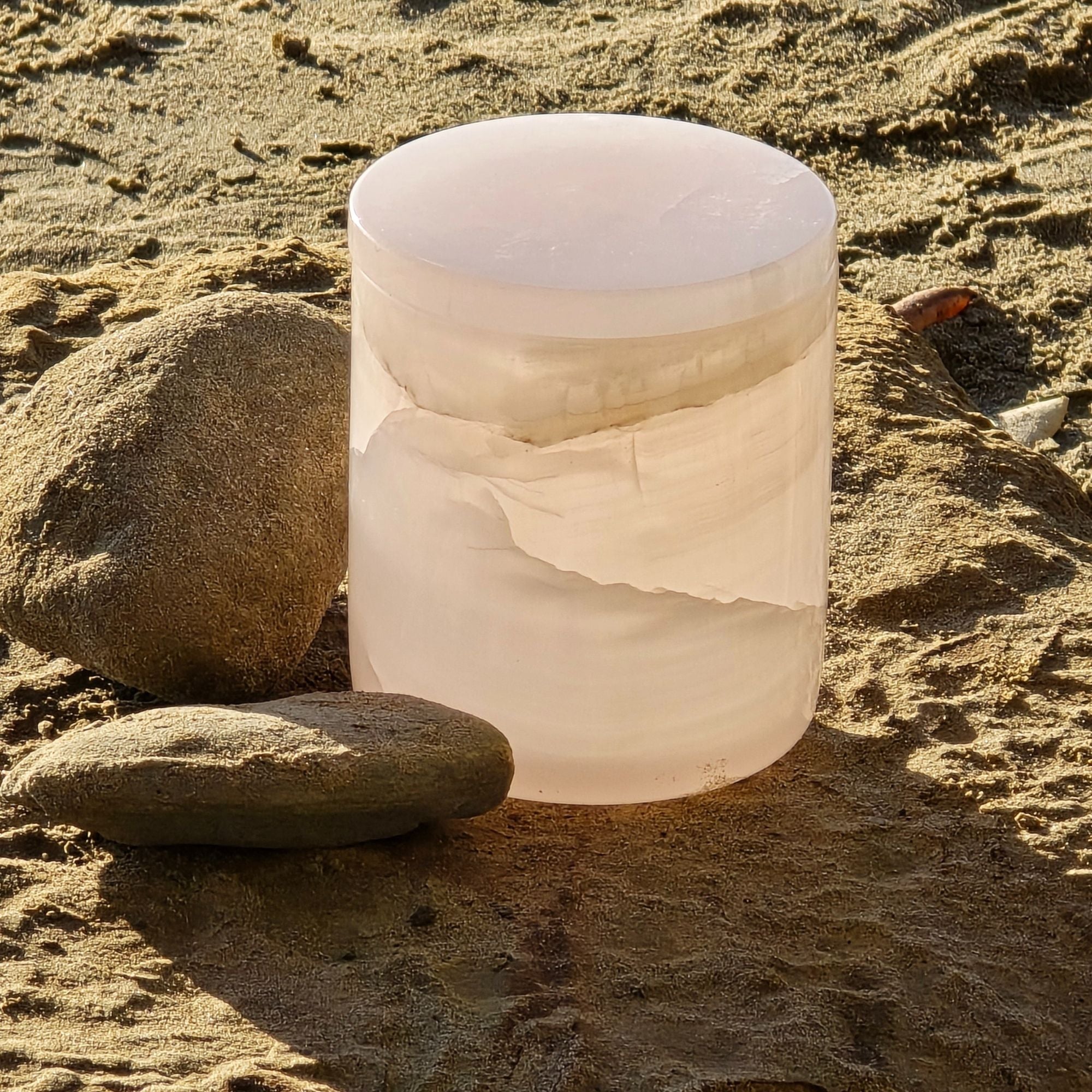 Pink onyx candle vessel — carved natural stone for ritual and lasting presence